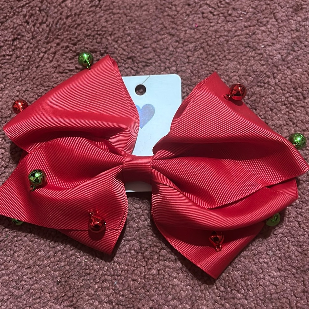 A red bow with bells; they jingle